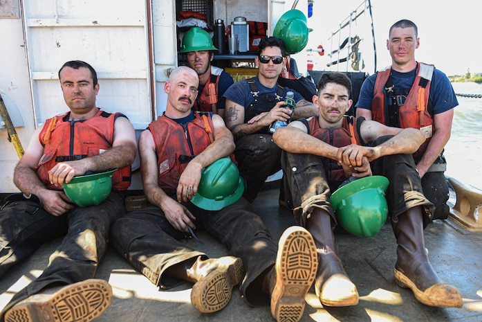 Crewmembers aboard USCGC Bluebell (WLI-313) take a break while servicing buoys on the Columbia River near Portland, Oregon, on July 15, 2020.