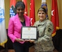 U.S. Army Reserve Ambassador Edna W. Cummings of Maryland receives the Patriotic Public Service Award June 13 during an annual training workshop held at 99th Readiness Division headquarters on Joint Base McGuire-Dix-Lakehurst, New Jersey. The award was presented by Maj. Gen. Kris A. Belanger, 99th RD commanding general. (U.S. Army photo by Mr. Shawn Morris, 99th RD Public Affairs)