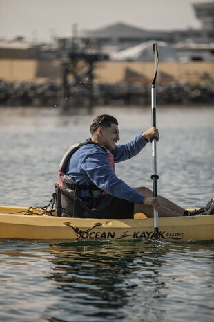 U.S. Marine Corps Pfc. Tony Antone, administrative specialist, with Headquarters Company, Marine Corps Recruit Depot San Diego, competes in a kayak relay event during the Headquarters and Service Battalion Atlas Games at MCRD San Diego, California, July 2, 2024. The H & S Battalion Atlas Games is a battalion field meet that incorporates leadership skills and team work to enhance individual readiness, unit cohesion, boost morale and foster esprit de corps among Marines. (U.S. Marine Corps photo by Lance Cpl. Alexandra M. Earl)