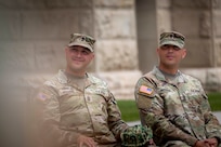 At a ceremony at the Wyoming State Capitol in Cheyenne June 27, 2024, Command Sgt. Maj. Edmundo Herrera, left, passed the guidon to his twin brother, Edwardo Herrera, who will now serve as the new command sergeant major of the Wyoming National Guard Recruiting and Retention Battalion.