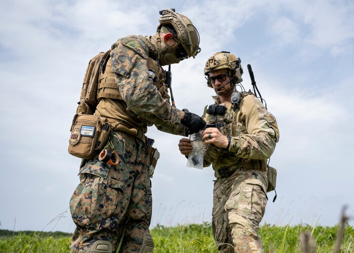 A U.S. Marine Corp and U.S. Air Force explosive ordnance disposal (EOD) technicians secure the remnants of a simulated explosive trap for analysis during Exercise Tanuki Bandit 24 at Draughn Range near Misawa Air Base, Japan, June 25, 2024.