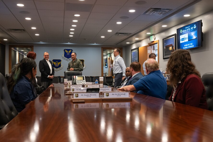 U.S. Air Force Col. Jesse Lamarand, 5th Bomb Wing commander, speaks with members of the Defense Nuclear Facilities Safety Board (DNFSB) during a base visit at Minot Air Force Base, North Dakota, June 10, 2024. The DNFSB reviews and evaluates the content and implementation of the standards relating to the design, construction, and operation of defense nuclear facilities. (U.S. Air Force photo by Senior Airman Kyle Wilson)