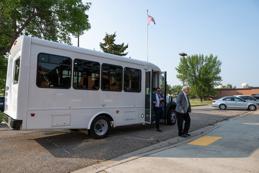 Members of the Defense Nuclear Facilities Safety Board (DNFSB) arrive at the 5th Bomb Wing headquarters during a base visit at Minot Air Force Base, North Dakota, June 10, 2024. The DNFSB is an independent organization chartered with the responsibility of providing recommendations and advice to the President and the Secretary of Energy regarding public health and safety issues at defense nuclear facilities. (U.S. Air Force photo by Senior Airman Kyle Wilson)