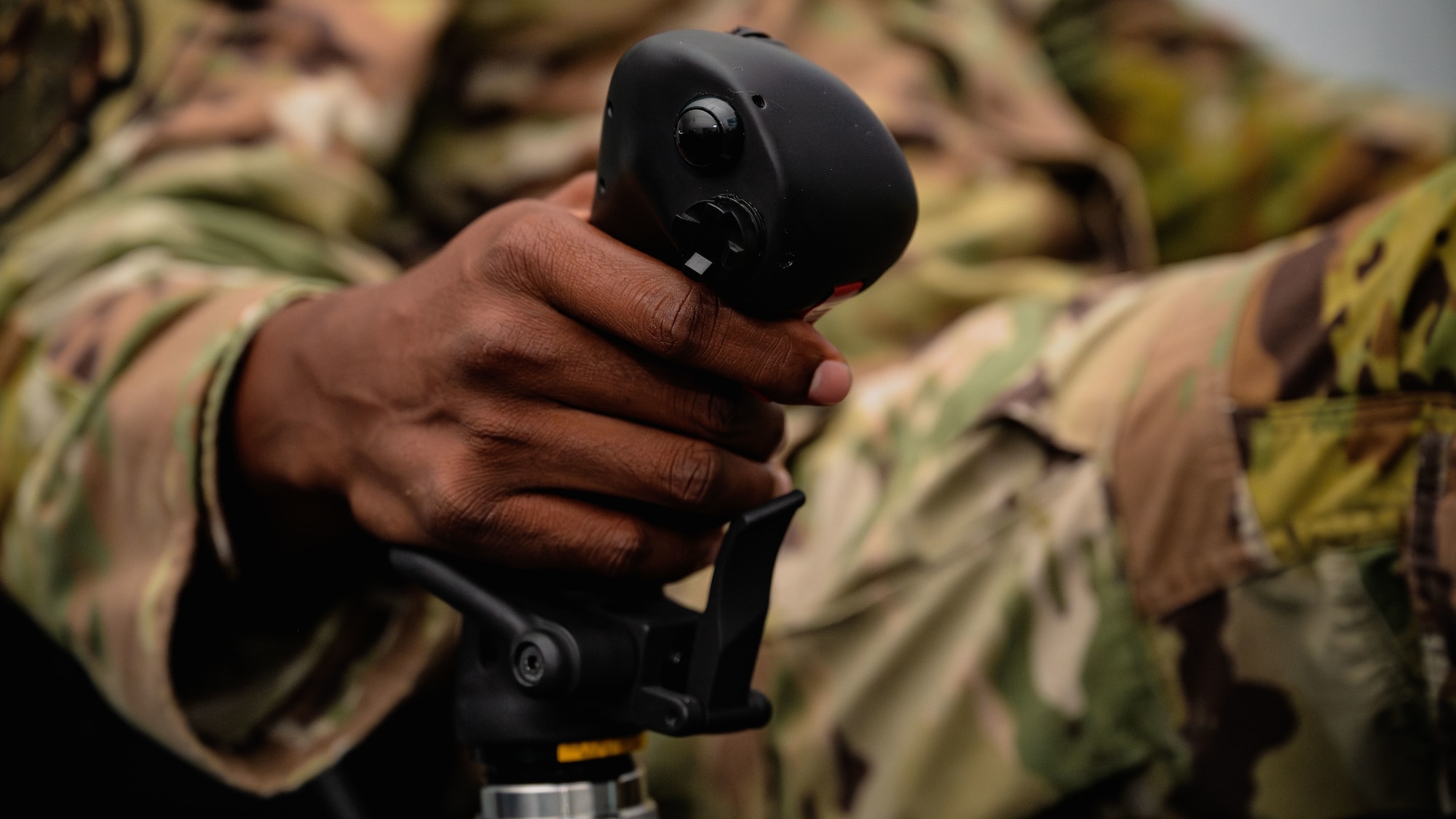 Airman grips control stick