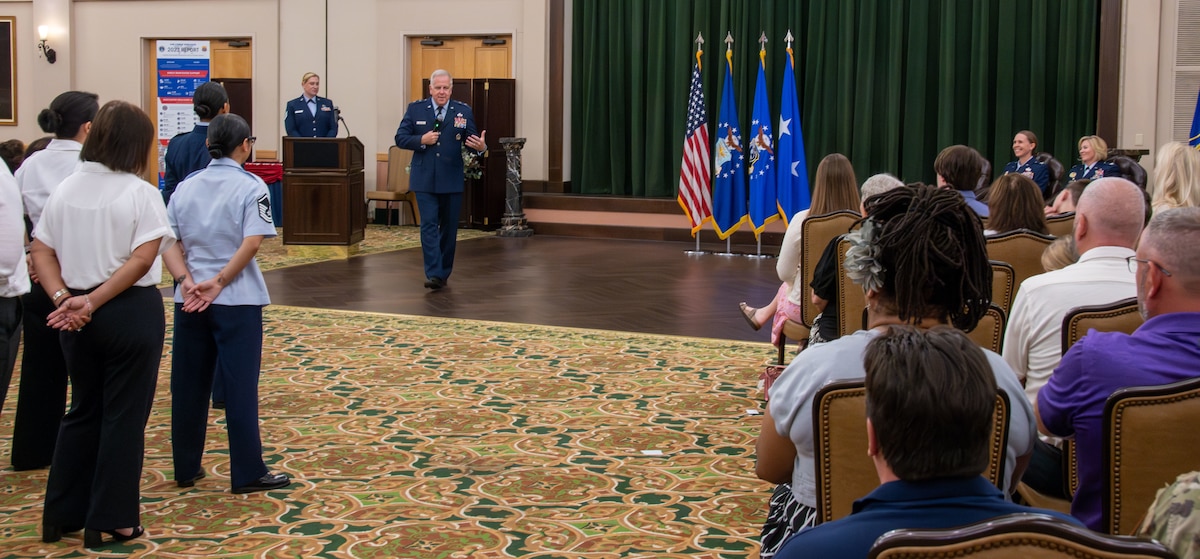 Maj. Gen. John Allen stands up and addresses  audience during ceremony