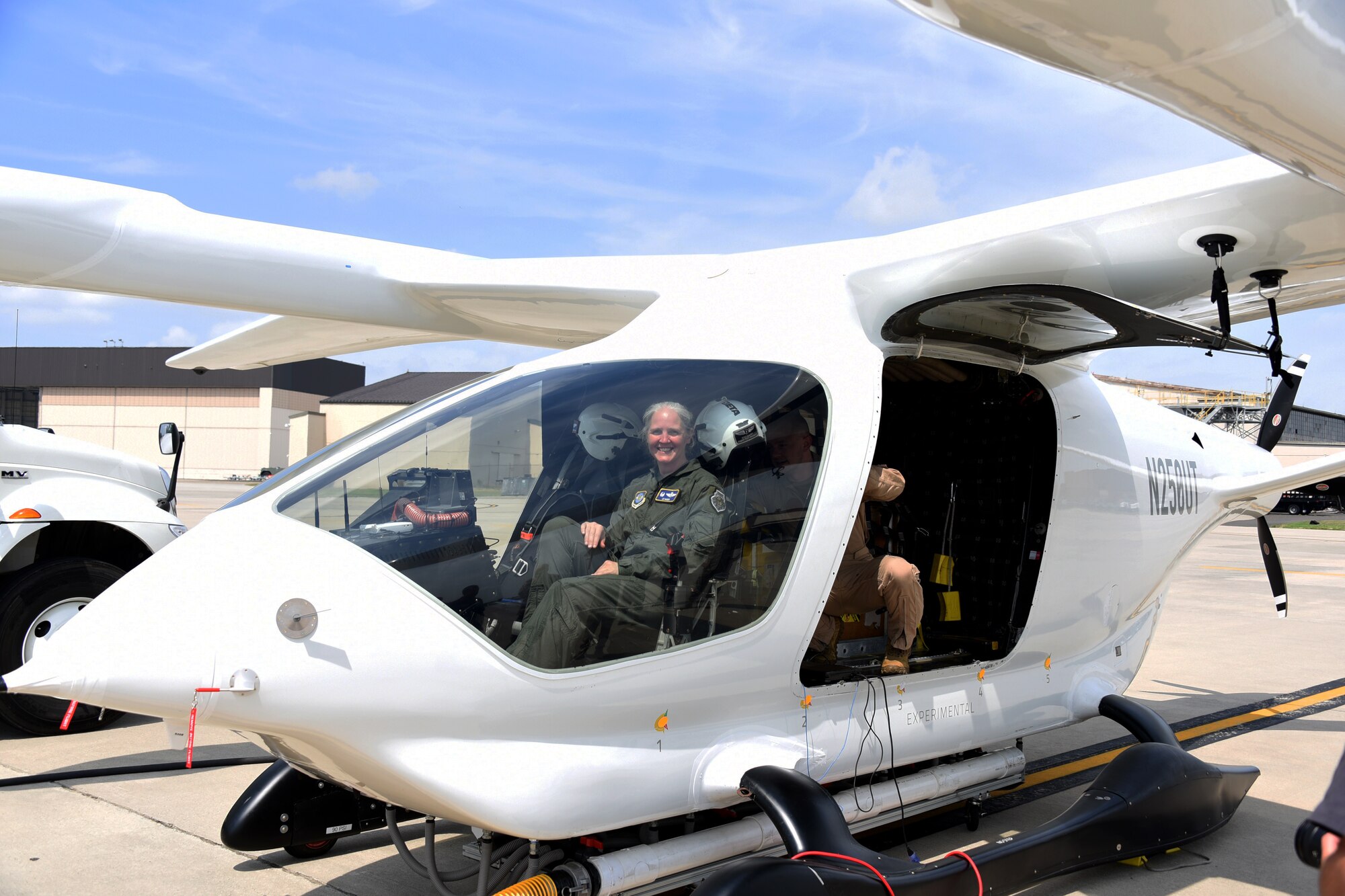 U.S. Air Force Col. Elizabeth Hanson, 305th Air Mobility Wing commander, sits in the cockpit of BETA Technologies prototype ALIA CTOL battery-powered fixed-wing aircraft at Joint Base McGuire-Dix-Lakehurst, NJ