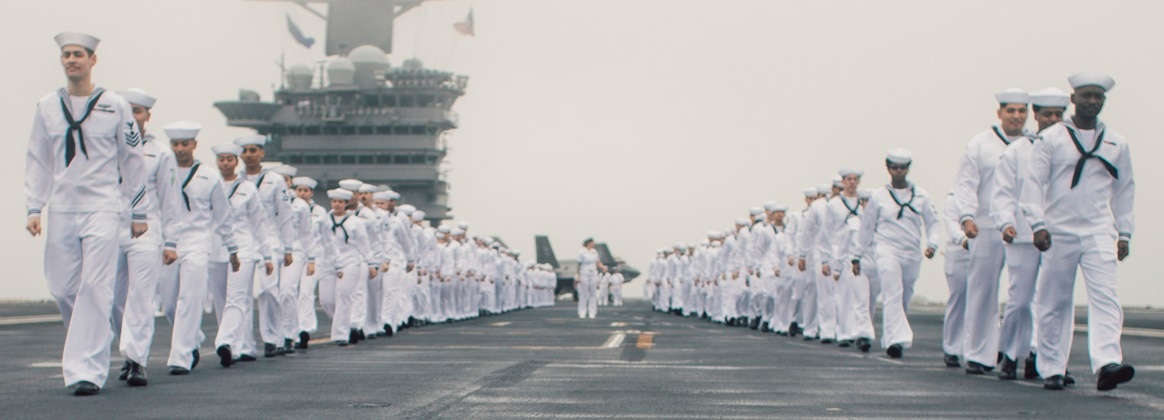 Sailors man the rails on the flight deck of Nimitz-class aircraft carrier USS George Washington (CVN 73) while underway in the Pacific Ocean, July 10, 2024.