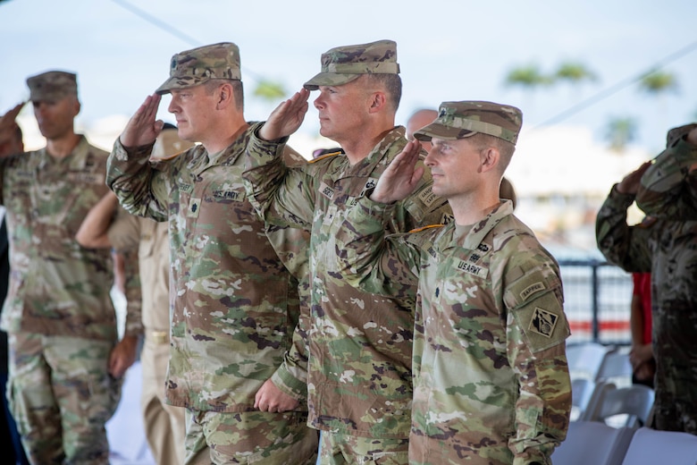 From left to right, Lt. Col. Christopher “Ryan” Pevey, Brig. Gen. Joseph C. “Clete” Goetz II, and Lt. Col. Adrian Biggerstaff salute the flag during the U.S. Army Corps of Engineers Honolulu District change of command ceremony aboard the Battleship Missouri Memorial July 10. Lt. Col. Biggerstaff assumes command as the 74th commander in the District's 119 year history.