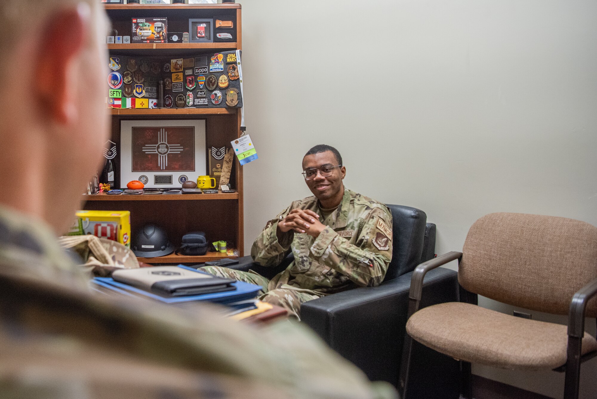 U.S. Air Force Senior Airman William Long, 51st Maintenance Group Aerospace Ground Equipment scheduler, talks to Master Sgt. Joshua Scholl, 51st Fighter Wing Safety Office occupational safety manager at Osan Air Base, Republic of Korea, June 24, 2024. The 51st FW Safety Office earned the 2023 Pacific Air Forces level Chief of Safety Outstanding Achievement Award Category II for all of their contributions to the base. (U.S. Air Force photo by Airman 1st Class Chase Verzaal)
