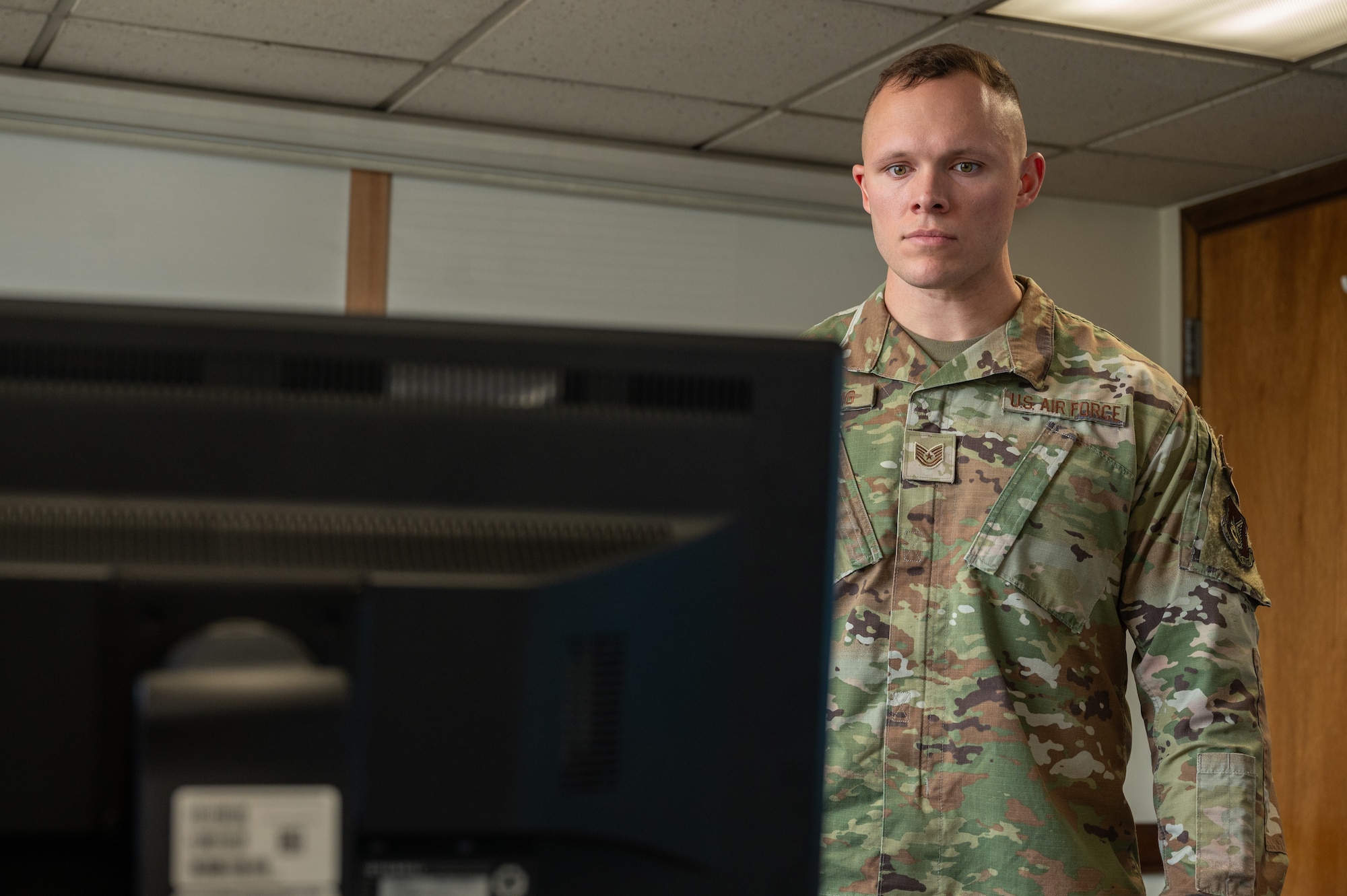 U.S. Air Force Tech. Sgt. Justin Manning, 51st Fighter Wing Safety Office noncommissioned officer in charge of occupational safety, validates a job safety training outline during an inspection of the U.S. Air Force Audit Agency at Osan Air Base, Republic of Korea, April 9, 2024. The safety office has an annual requirement to inspect every building on base to ensure that they meet the required standards for daily operations. (U.S. Air Force photo by Airman 1st Class Chase Verzaal)