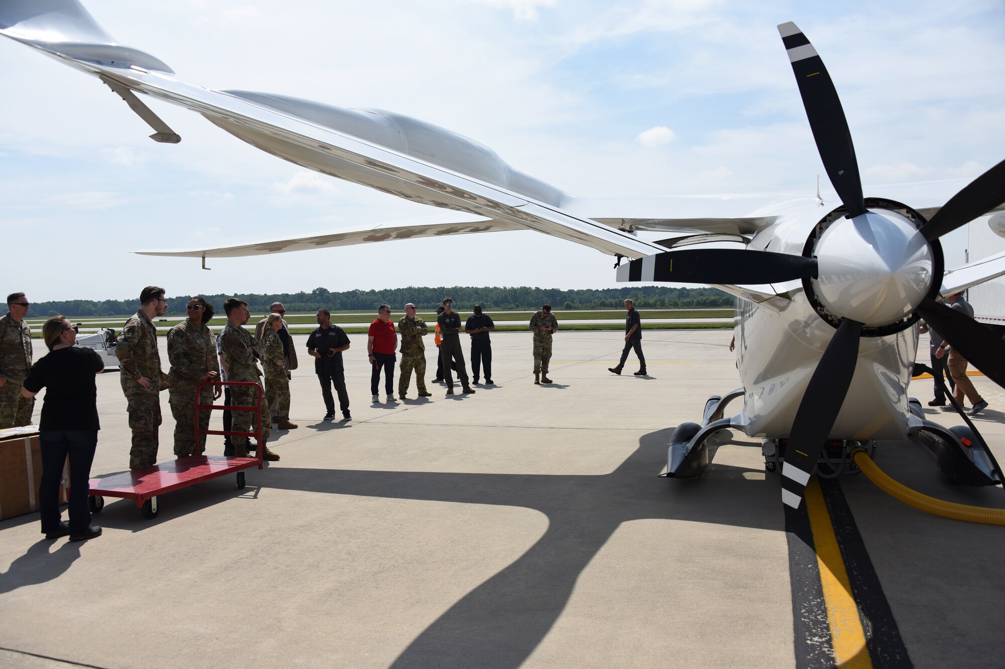 Alyxandra Scalone, 305 Maintainance Squadron Production Controller (right), and her Precision Measurement Equipment Laboratory team prepare to unload cargo on BETA Technologies prototype ALIA CTOL battery-powered fixed-wing aircraft at Joint Base McGuire-Dix-Lakehurst, NJ