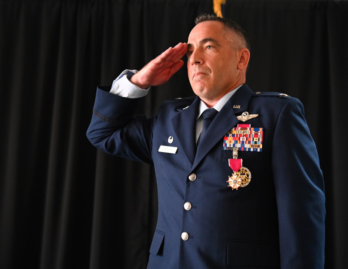 U.S. Air Force Col. Josh Koslov, 350th Spectrum Warfare Wing outgoing commander, salutes after receiving the Legion of Merit Medal for his service as wing commander at Eglin Air Force Base, Florida, July 9, 2024. Koslov oversaw the stand up of five units at the wing, including the historic 388th Electronic Warfare Squadron and 563d EWS, along with the initial detachments that are projected to become the future 950th Spectrum Warfare Group at Robins AFB, GA, focusing on the assessment of Air Force Electromagnetic Warfare capabilities to ensure the readiness of the Combat Air Force. (U.S. Air Force photo by Senior Airman Anna Smith)