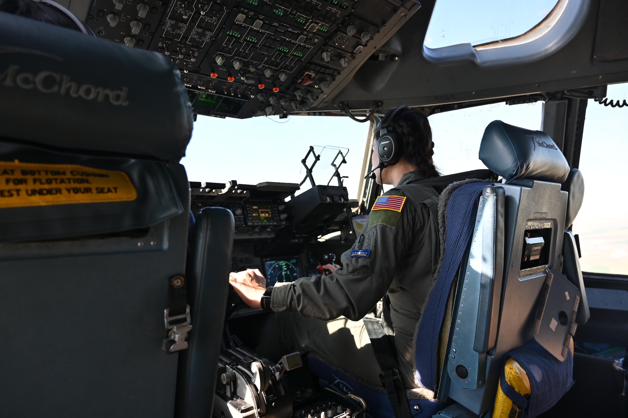 U.S. Air Force 1st Lt. Carolyn Mickelson, a pilot with the 7th Airlift Squadron, flies a C-17 Globemaster III during a local flight with cadets from the United States Air Force Academy at Joint Base Lewis-McChord, Washington, July 2, 2024.