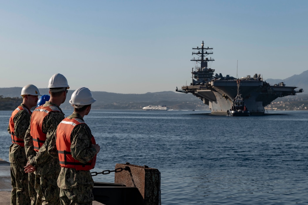 Sailors assigned to Naval Support Activity (NSA) Souda Bay, prepare to moor the Nimitz-class aircraft carrier USS Dwight D. Eisenhower (CVN 69) at the NATO Marathi Pier Complex in Souda Bay, Greece, during a scheduled port visit on June 25, 2024. NSA Souda Bay provides logistical and operational support to the components of the Dwight D. Eisenhower Carrier Strike Group, which arrived in the Eastern Mediterranean after an eight-month deployment in the U.S. 5th Fleet area of operations.