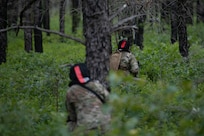 Airmen assigned to the 171st Civil Engineer Squadron and the 177th Civil Engineer Squadron perform land navigation and simulated combat training exercises as part of the Piney Devil training exercise June 9, 2024, at Warren Grove Range, New Jersey.