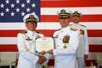Vice Adm. Thomas E. Ishee, commander, U.S. 6th Fleet and Naval Striking and Support Forces NATO, presents Capt. Kenneth S. Pickard, the commanding officer of Commander, Task Force 63/Military Sealift Command Europe and Africa, with Legion of Merit award during change of command ceremony, July 10, 2024.