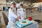 Captain Todd B. Penrod, incoming commanding officer of Commander, Task Force 63/Military Sealift Command Europe and Africa, and Captain Kenneth S. Pickard, former commanding officer of CTF-63/Military Sealift Command Europe and Africa, participate in cake cutting during change of command ceremony, July 10, 2024.