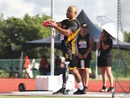 U.S. Army veteran Gene Calantoc prepares to throw the discus