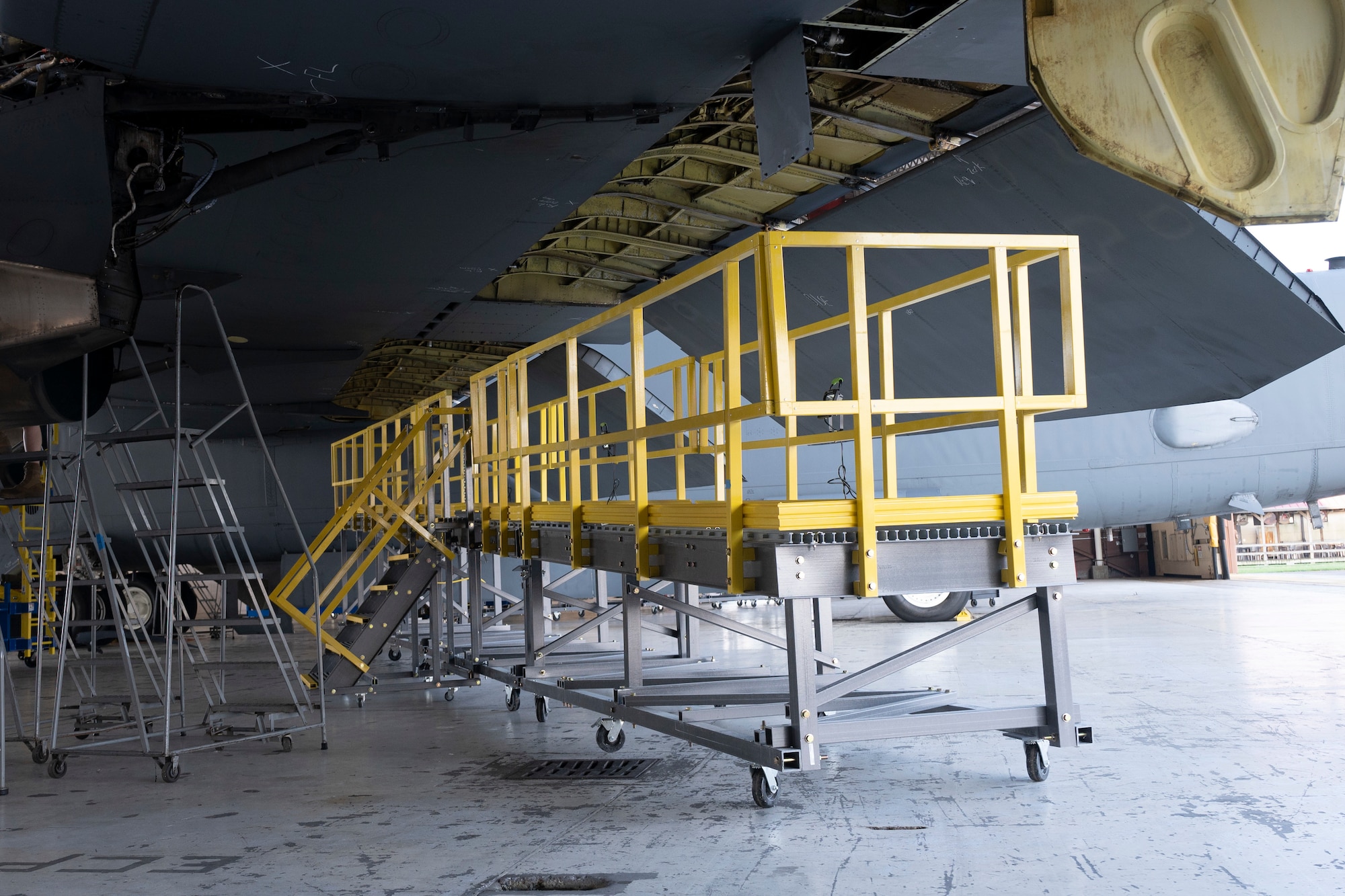 Airmen work on Engine Pod Stands.