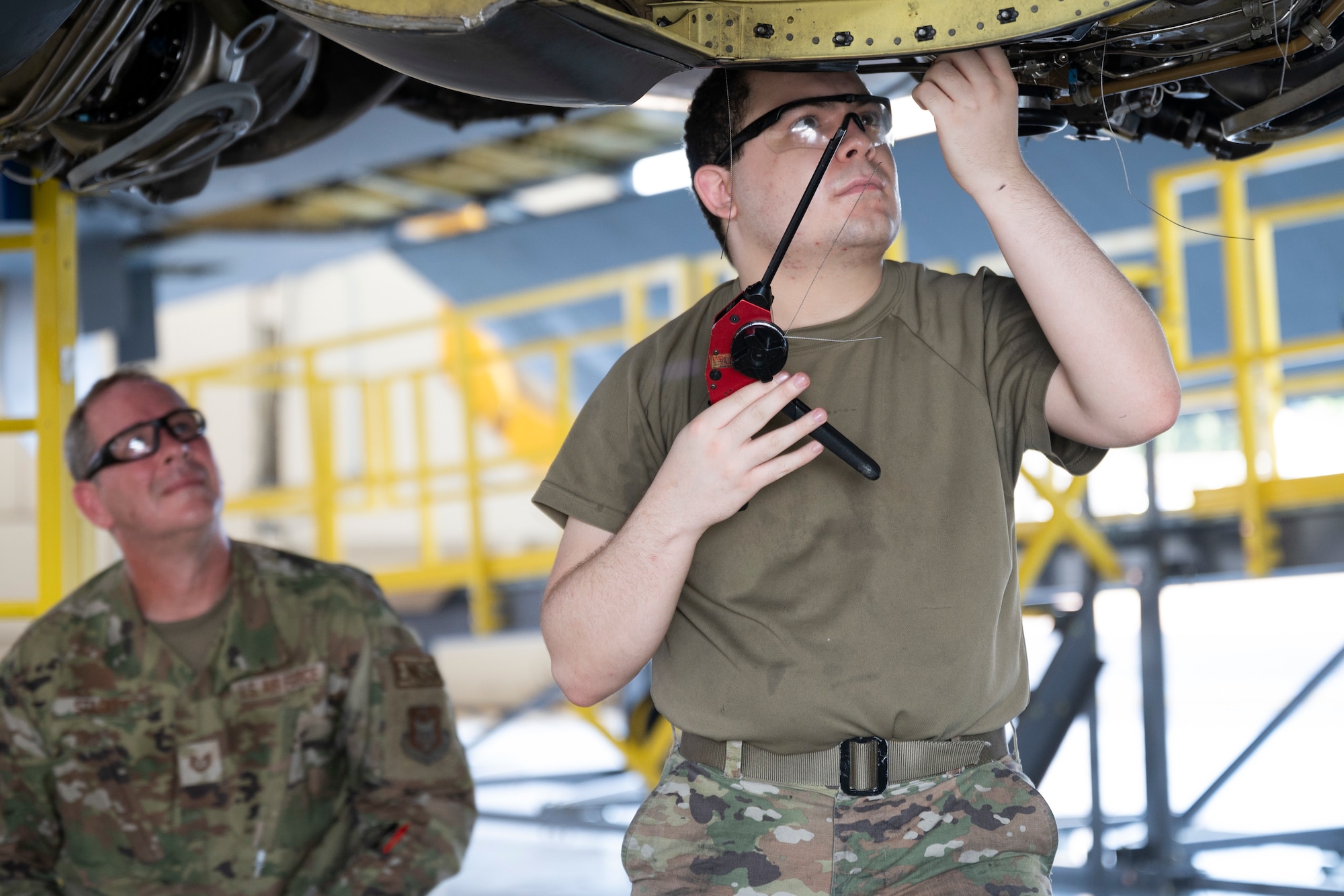 Airmen work on Engine Pod Stands.