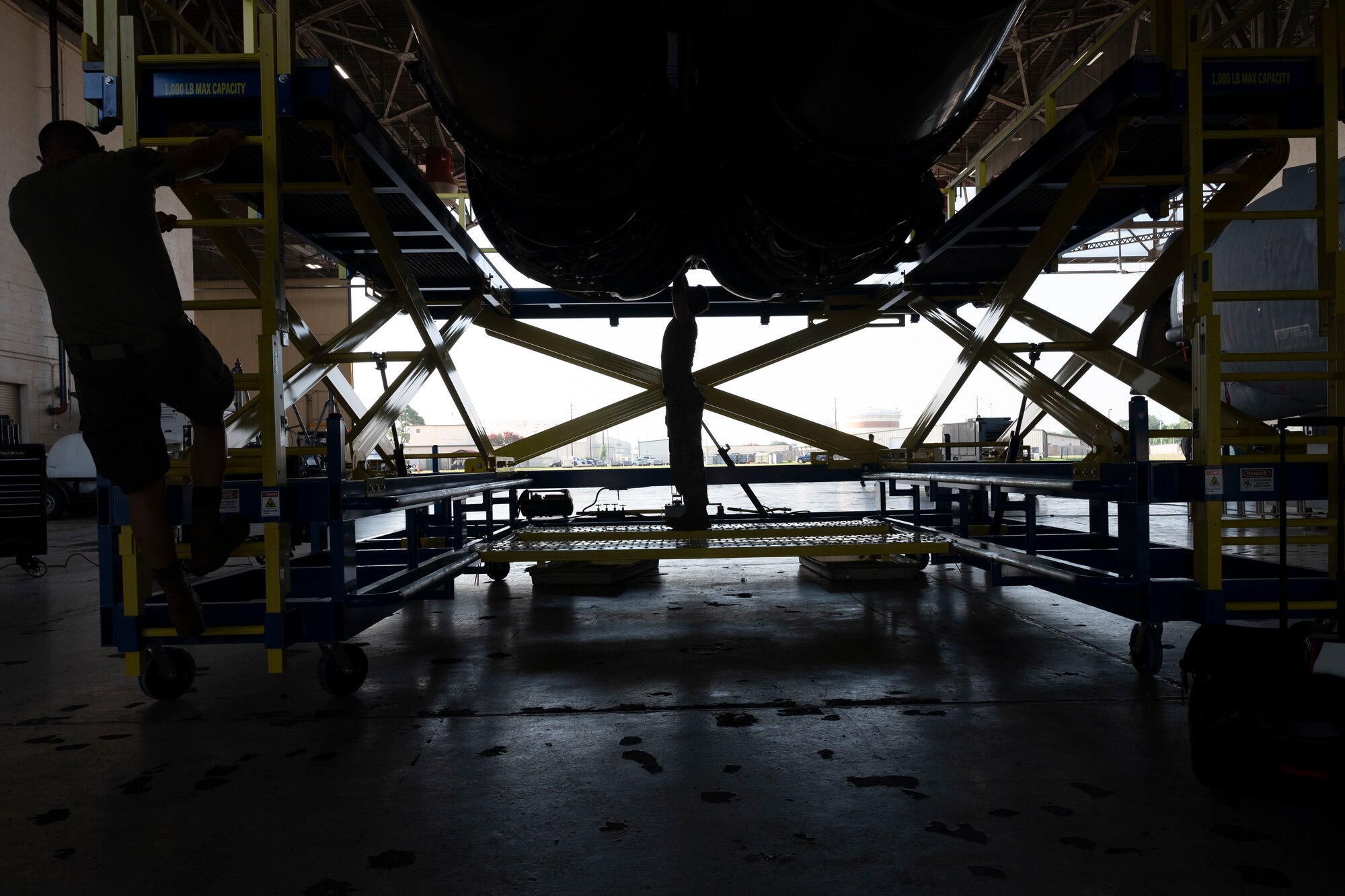 Airmen work on Engine Pod Stands.