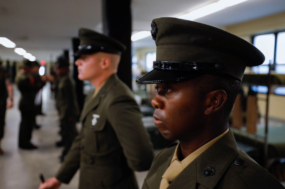 U.S. Marine Corps Pvt. Oluwagbemiga Omotoye, a Marine with Echo Company, 2nd Recruit Training Battalion, stands ready for inspection during the Battalion Commander's Inspection on Marine Corps Recruit Depot Parris Island, S.C., July 5 2024. The inspection is the battalion commander's last time to inspect his Marines and correct any deficiencies before the Marines complete recruit training. (U.S. Marine Corps Depot photo by Lance Cpl. William Horsley)