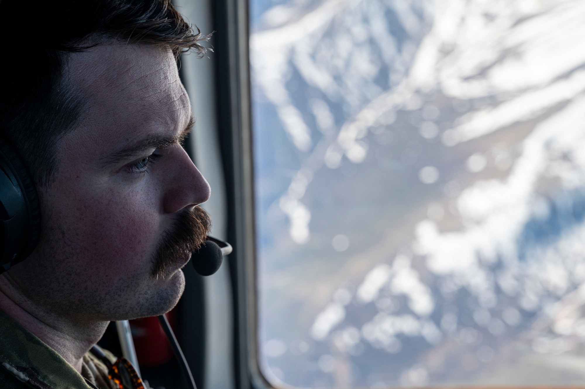 U.S. Air Force Capt. Alexander Warren, 6th Airlift Squadron (AS) C-17 Globemaster III pilot, flies over Anchorage, Alaska in support of Valiant Shield 2024 June 4, 2024. Exercises such as Valiant Shield allow the Indo-Pacific Command Joint Forces the opportunity to integrate forces from all branches of service and with our allies to conduct precise, lethal, and overwhelming multi-axis, multi-domain effects that demonstrate the strength and versatility of the Joint Force and our commitment to a free and open Indo-Pacific. (U.S. Air Force photo by Senior Airman Keegan Putman)