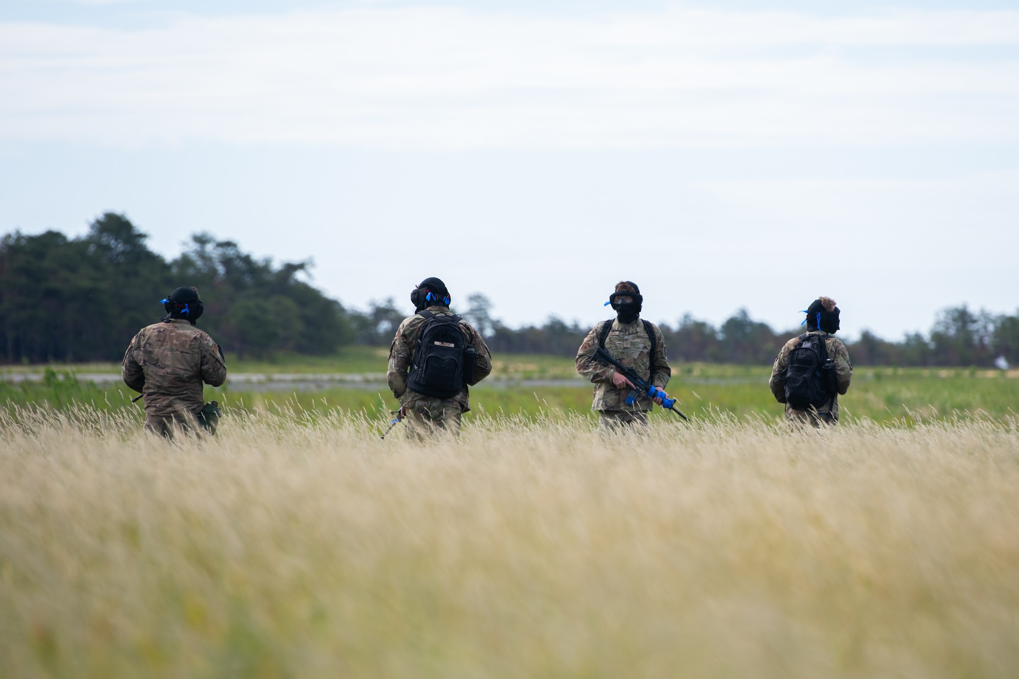 Airmen assigned to the 171st Civil Engineer Squadron and the 177th Civil Engineer Squadron perform land navigation and simulated combat training exercises as part of the Piney Devil training exercise on June 9, 2024, at Warren Grove Range, New Jersey.