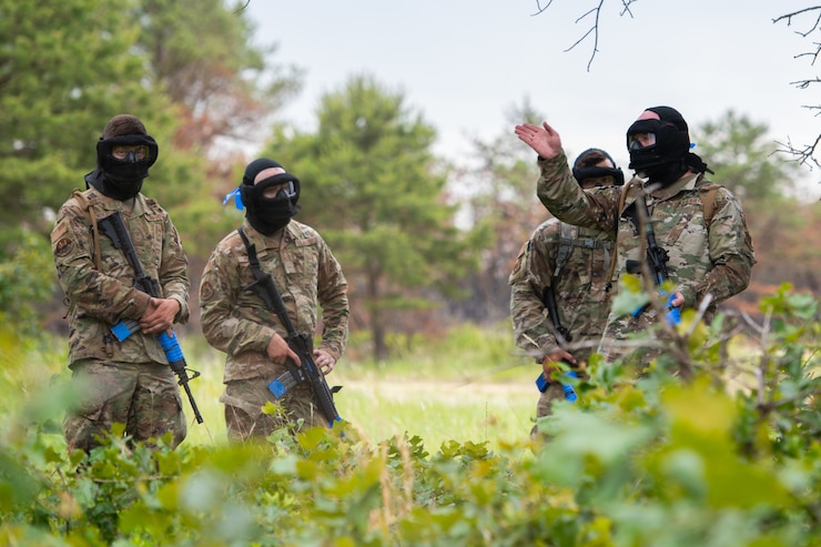 Airmen assigned to the 171st Civil Engineer Squadron and the 177th Civil Engineer Squadron perform land navigation and simulated combat training exercises as part of the Piney Devil training exercise on June 9, 2024, at Warren Grove Range, New Jersey.