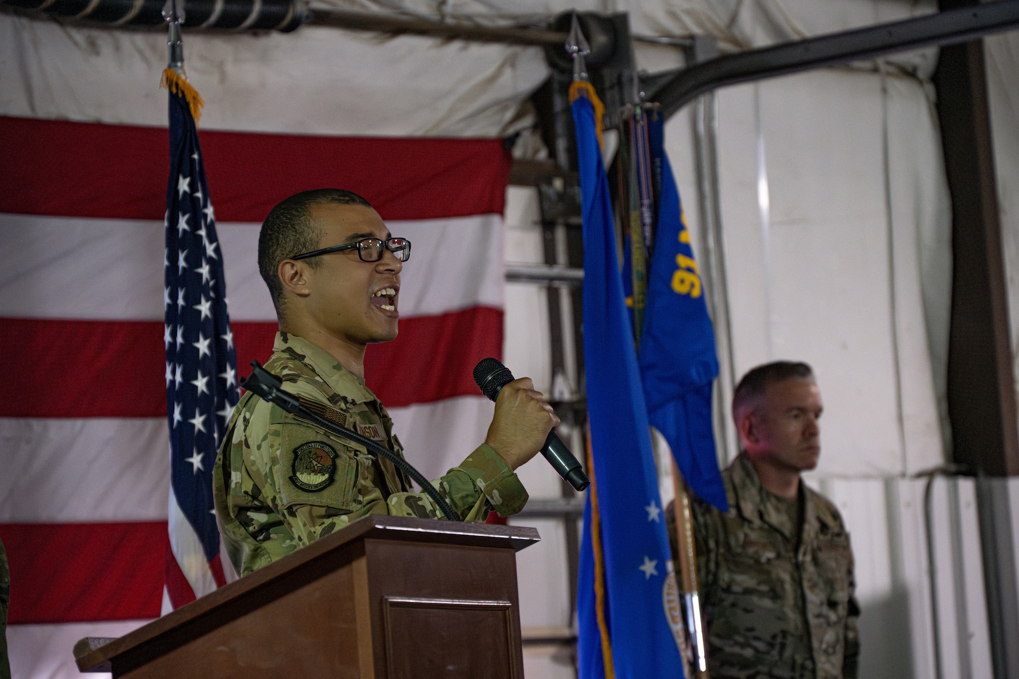 U.S. Air Force 2nd Lt. Elijah Robinson, 741st Missile Squadron nuclear and missile operator, sings the national anthem at the 91st Operations Group (OG) assumption of command ceremony at Minot Air Force Base, North Dakota, July 10, 2024. The 91st OG is comprised of four squadrons; the 91st Operations Support Squadron, and the 740th, 741st and 742nd Missile Squadrons that continue to be an essential component of the U.S.’s deterrent force, maintaining Minot's missiles in a safe, secure and operational state. (U.S. Air Force photo by Airman 1st Class Alyssa Bankston)
