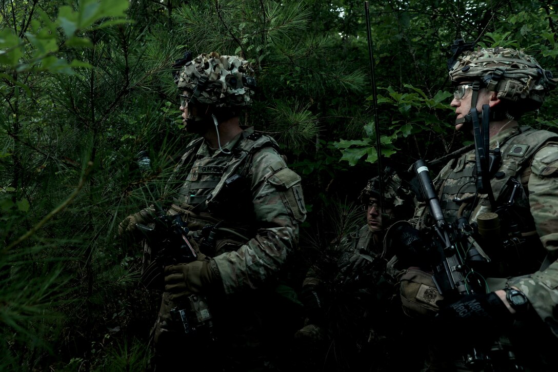 Soldiers from the Wisconsin Army National Guard’s 32nd “Red Arrow” Infantry Brigade Combat Team conduct a combat patrol wearing multiple integrated laser engagement system (MILES) gear June 8 during a rotation at the Joint Readiness Training Center, Fort Johnson, La. The Red Arrow led more than 5,000 Soldiers from across the United States and Canada in simulated large-scale combat operations. This realistic training builds readiness for overseas deployments and prepares Soldiers to survive the rigors of war. 32nd IBCT photo by Staff Sgt. Kati Volkman