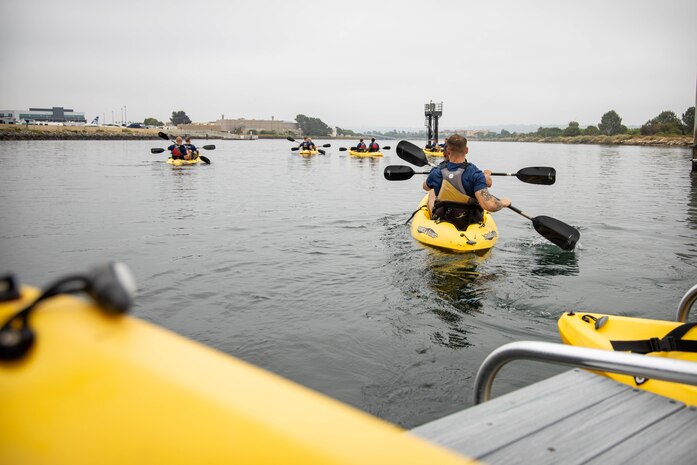 U.S. Marines with 3rd Recruit Training Battalion, participate in a kayak team-building event at the marina on Marine Corps Recruit Depot San Diego, July 1, 2024. The staff of 3rd Recruit Training Battalion conducted a kayak team-building event as part of sergeant major's battalion physical training to foster unit cohesion between the officers and enlisted Marines. (U.S. Marine Corps photo by Lance Cpl. Eric Valerio)