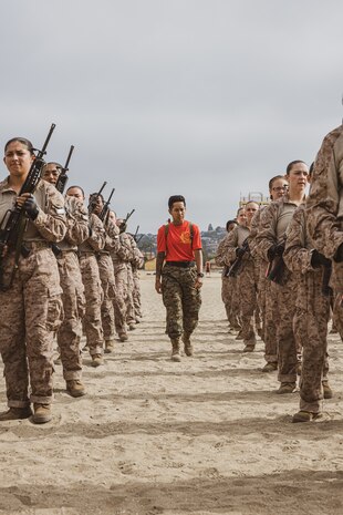 U.S. Marine Corps Drill Instructor Sgt. Gisela Sanchez, with Charlie Company, 1st Recruit Training Battalion, observes recruits executing Marine Corps Martial Arts Program bayonet techniques at Marine Corps Recruit Depot San Diego, California, July 3, 2024. Bayonet techniques tie into MCMAP that aims to strengthen the mental and moral resiliency of individual recruits and Marines through realistic combative training, warrior ethos studies, and physical hardening. (U.S. Marine Corps photo by Cpl. Sarah M. Grawcock)