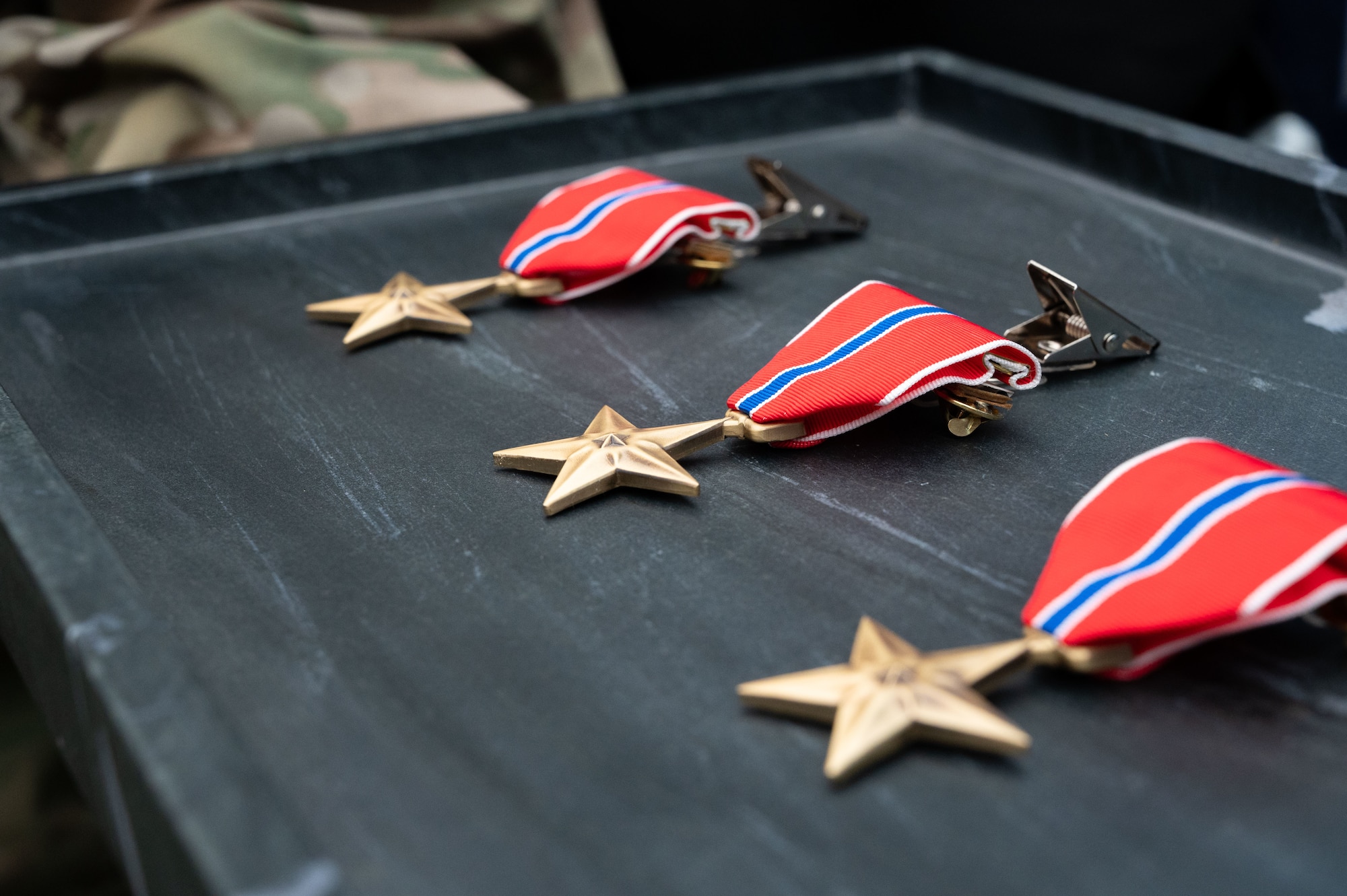 Bronze Star medals are displayed on a table