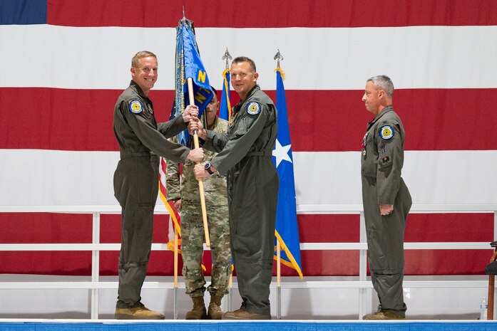 Air Force commanders taking part in passing the guidon from the old to the new Nevada Test and Training Range commanders