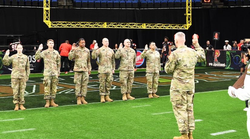 AR-MEDCOM DCG Collard leads affirmation of enlistment ceremony at Arena Football game