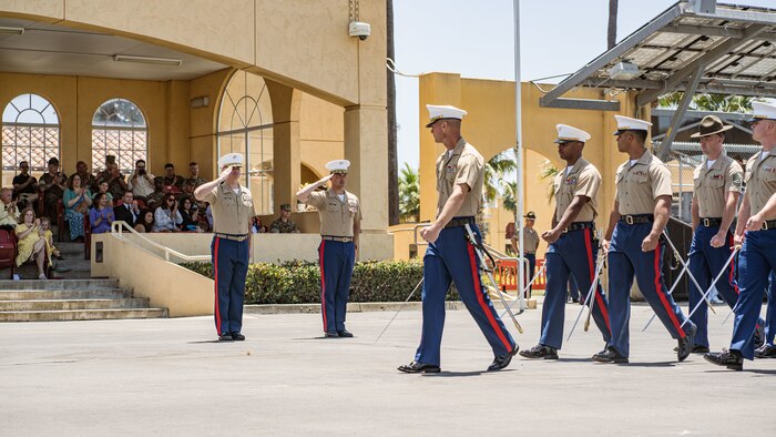 U.S. Marine Corps Lt. Col. Paul Trower, the oncoming commanding officer of 2nd Recruit Training Battalion, Recruit Training Regiment, left, and Lt. Col. James Smith, the outgoing commanding officer of 2nd Recruit Training Battalion, left center, conduct pass and review during the change of command ceremony for 2nd Recruit Training Battalion at Marine Corps Recruit Depot San Diego, California, June 27, 2024. Smith relinquished command of 2nd Recruit Training Battalion to U.S. Marine Corps Lt. Col. Paul Trower. (U.S. Marine Corps photo by Sgt. Jesse K. Carter-Powell)