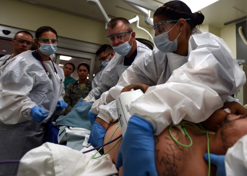 Emergency room personnel treat patient