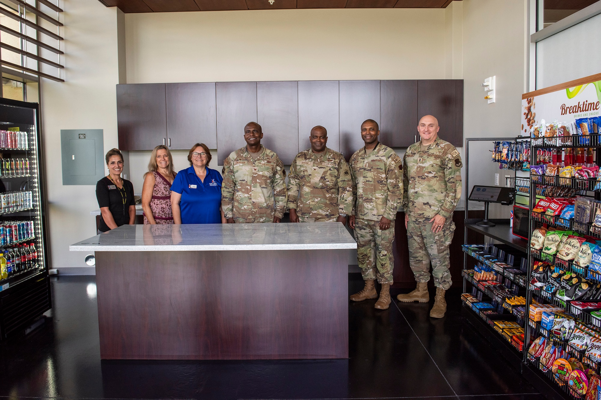 Leadership from the Air Force Technical Applications Center, Space Launch Delta 45, and the Army & Air Force Exchange Service pose for a photo June 28, 2024 in AFTAC’s new “Atomic Java” café before cutting the ribbon to commemorate the opening of the micromart at Patrick Space Force Base, Fla.   (U.S. Air Force photo by Matthew S. Jurgens)