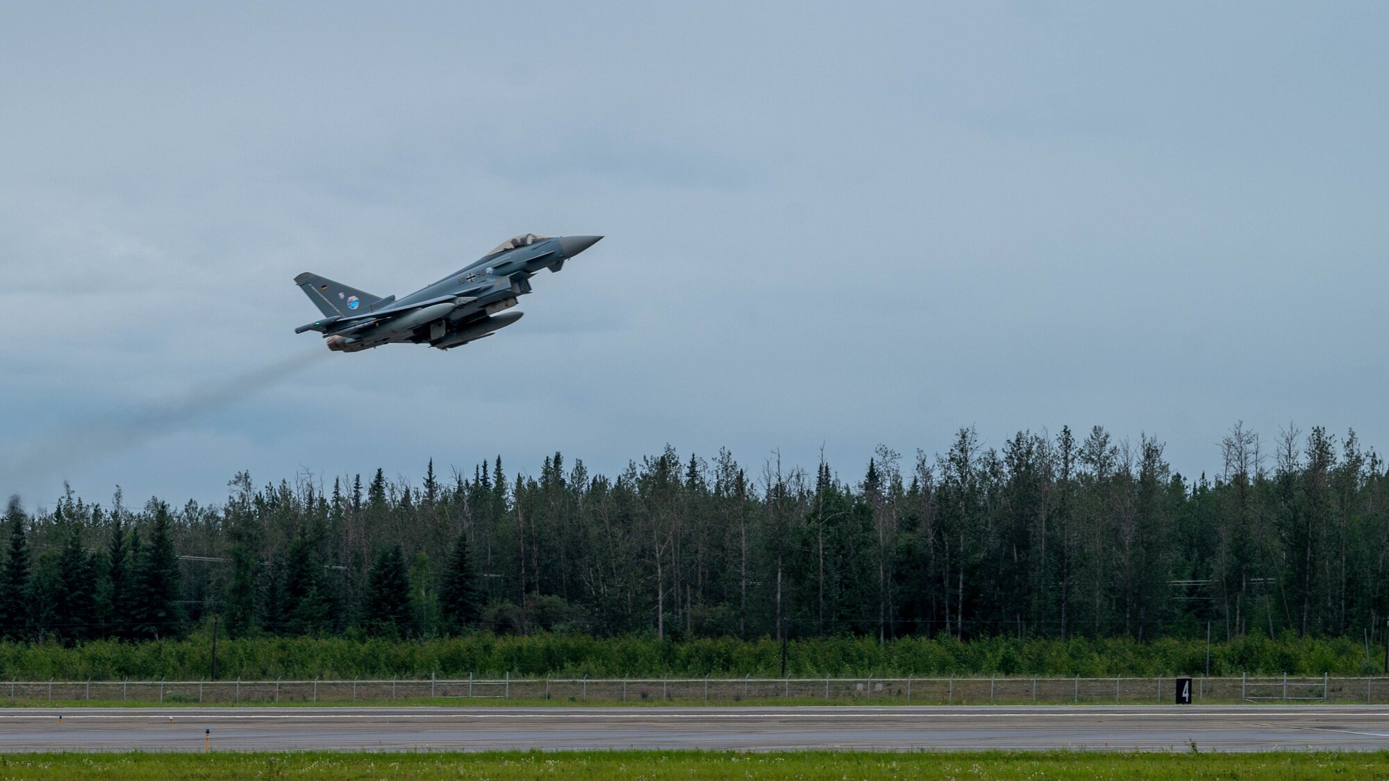 A Eurofighter typhoon aircraft takes off in the air.