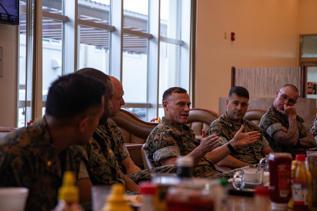 U.S. Marine Corps Maj. Gen. Brian Wolford, center, the commanding general of Marine Corps Installations Pacific, and a Maryland native, discusses issues on Marine Corps Air Station Iwakuni with installation leadership during a breakfast at MCAS Iwakuni, Japan, June 18, 2024. Leadership from MCIPAC toured MCAS Iwakuni to speak with service members and learn more about air station operations. (U.S. Marine Corps photo by Lance Cpl. Rylan Adcock)