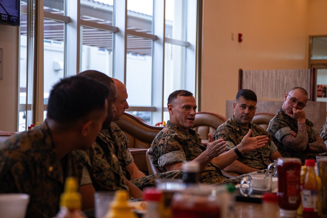 U.S. Marine Corps Maj. Gen. Brian Wolford, center, the commanding general of Marine Corps Installations Pacific, and a Maryland native, discusses issues on Marine Corps Air Station Iwakuni with installation leadership during a breakfast at MCAS Iwakuni, Japan, June 18, 2024. Leadership from MCIPAC toured MCAS Iwakuni to speak with service members and learn more about air station operations. (U.S. Marine Corps photo by Lance Cpl. Rylan Adcock)