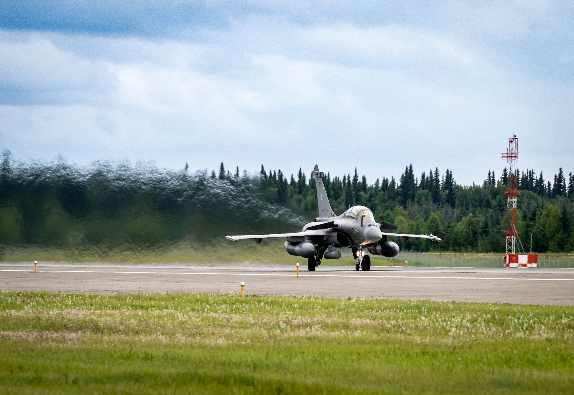 A French Rafale fighter jet prepares taxis for takeoff.