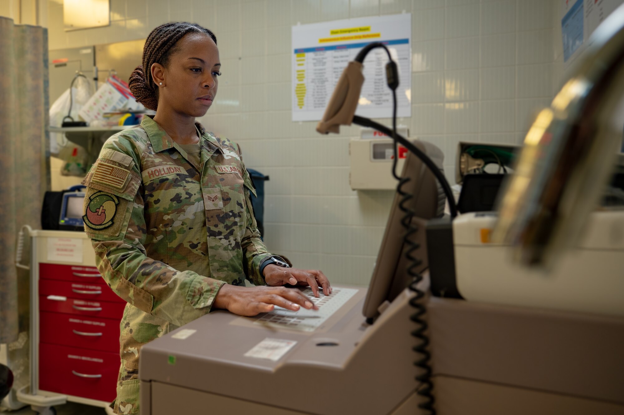 U.S. Air Force Senior Airman LaQuita Holliday, 51st Healthcare Operations Squadron urgent care medical technician, performs operational checks at Osan Air Base, Republic of Korea, July 8, 2024. Holliday was named Mustang of the Week for her role in delivering urgent medical care and support to the 51st Fighter Wing's personnel, their families, and civilians. She plays a vital role in ensuring the readiness and well-being of the 51st FW members, providing life-saving procedures, patient assessment, and comprehensive care. (U.S. Air Force photo by Senior Airman Brittany Russell)