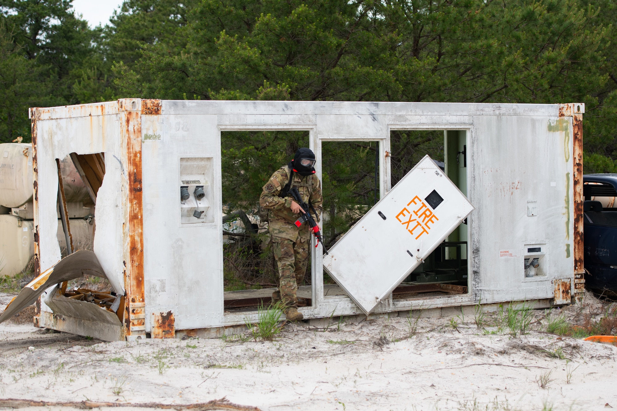 Airmen assigned to the 171st Civil Engineer Squadron and the 177th Civil Engineer Squadron perform land navigation and simulated combat training exercises as part of the Piney Devil training exercise on June 9, 2024, at Warren Grove Range, New Jersey.