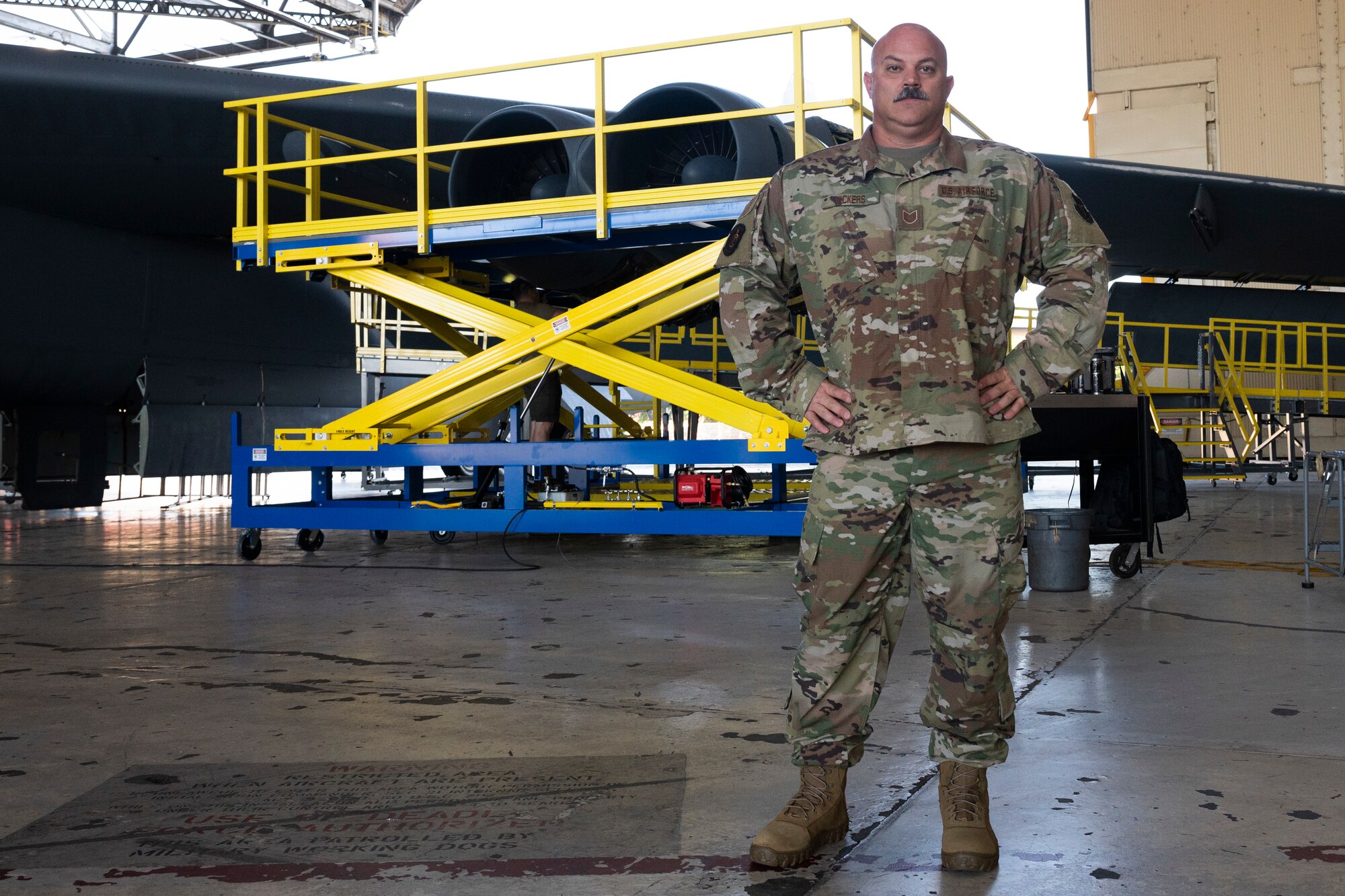 Airmen work on Engine Pod Stands.