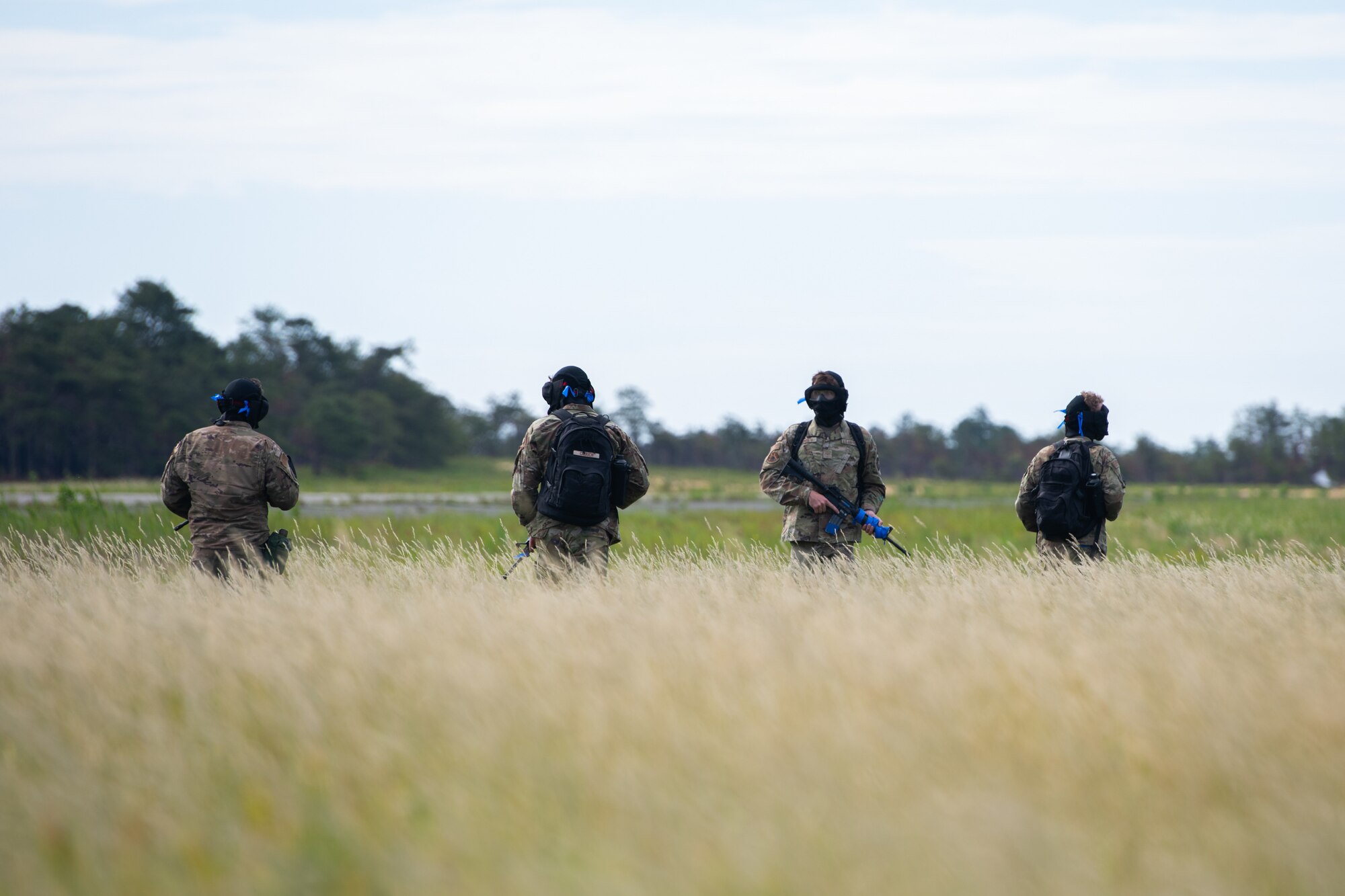 Airmen assigned to the 171st Civil Engineer Squadron and the 177th Civil Engineer Squadron perform land navigation and simulated combat training exercises as part of the Piney Devil training exercise on June 9, 2024, at Warren Grove Range, New Jersey.