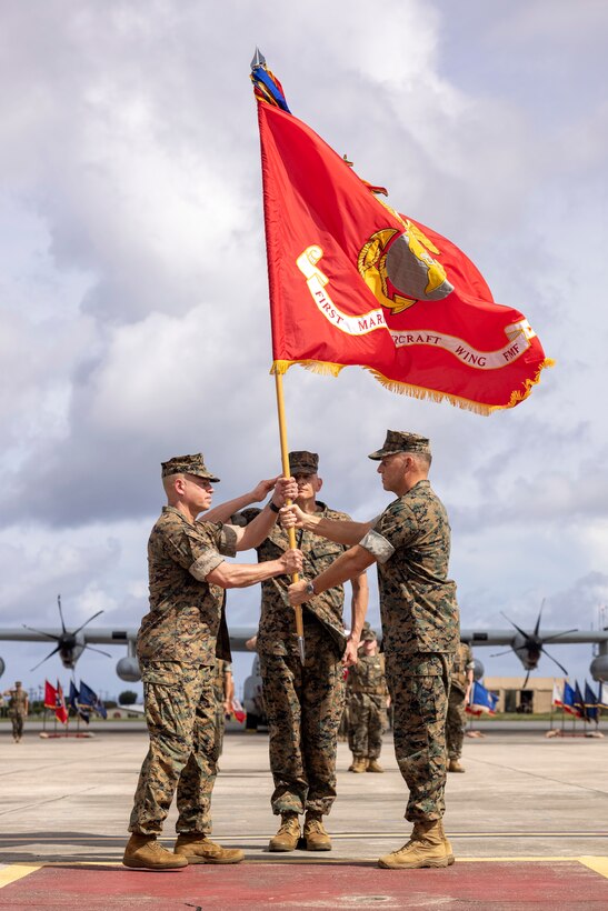 U.S. Marine Corps Maj. Gen. Eric E. Austin, right, the outgoing commanding general, relinquishes command of 1st Marine Aircraft Wing to Maj. Gen. Marcus B. Annibale during a change of command ceremony at Marine Corps Air Station Futenma, Okinawa, Japan, July 12, 2024. 1st MAW is the aviation combat element of III Marine Expeditionary Force. Its mission is to conduct air operations in support of the Fleet Marine Forces to include offensive air support, anti-air support, assault support, aerial reconnaissance, electronic warfare, and control of aircraft and missiles. (U.S. Marine Corps photo by Lance Cpl. Sav Ford)