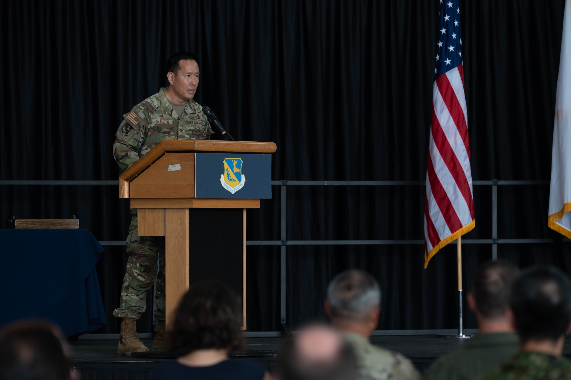 airmen saluting, honoring ceremony of change of leadership