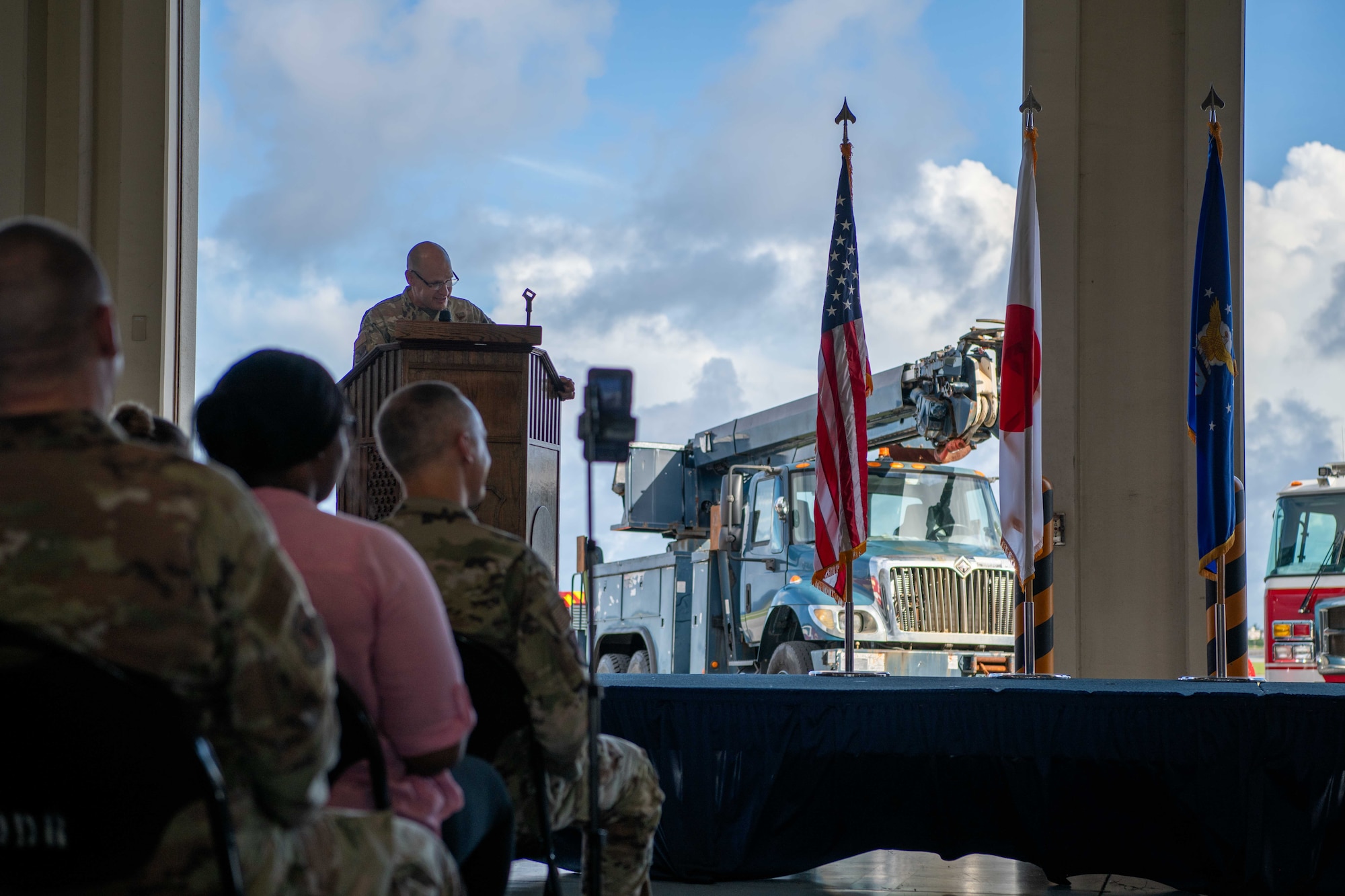 military member speaks at a podium giving a speech